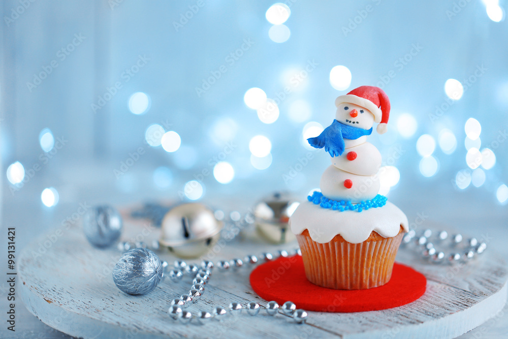 Christmas cupcake with lights on background Christmas cupcake with lights on background