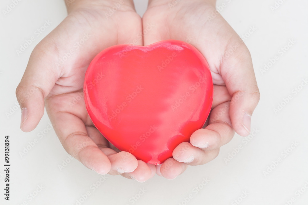 Red heart in the hand Red heart in the hand