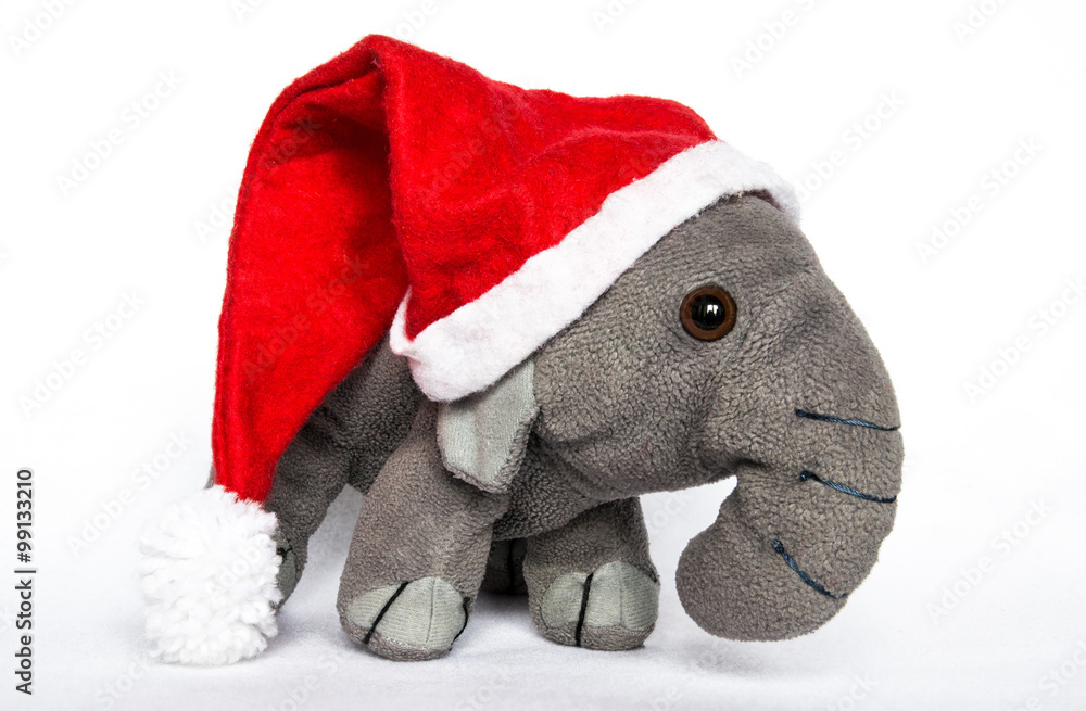 Elefante peluche con cappello natalizio Stock Photo | Adobe Stock