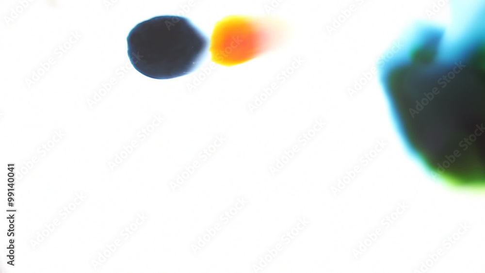 Yellow and blue paint colors expand, creating copy space. Yellow and blue paint colors expand, creating copy space.