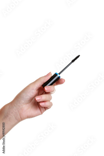 Female hand with mascara for make-up isolated on white
