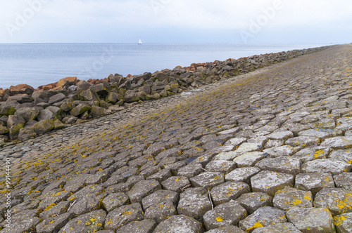 Dutch dike by the North Sea made of concrete stones, Netherlands