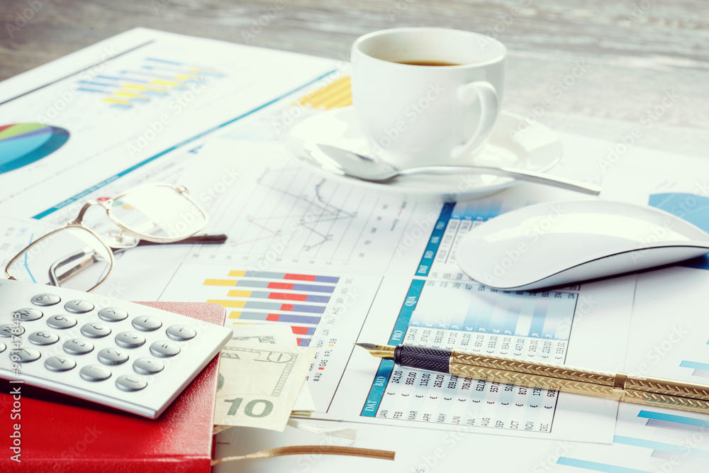 Financial charts and graphs on the table Financial charts and graphs on the table