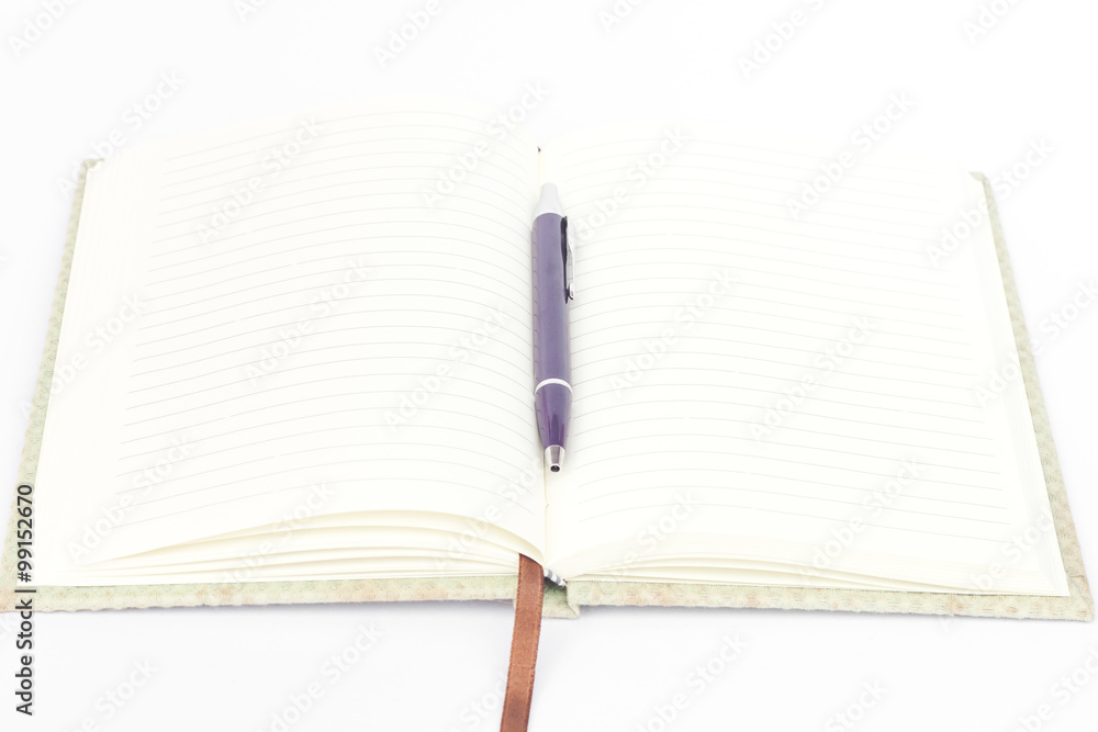 Naklejka premium Notebook with pen isolated on white background