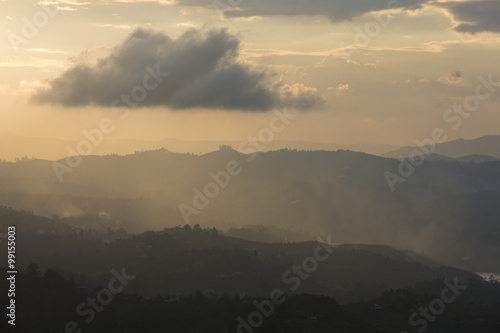 Fototapeta Naklejka Na Ścianę i Meble -  Sunset and mountains at Guatape in Antioquia, Colombia