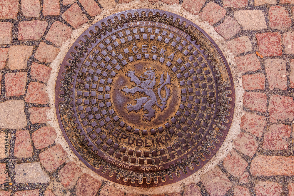 Ornate manhole cover with Bohemian coat of arms  lion