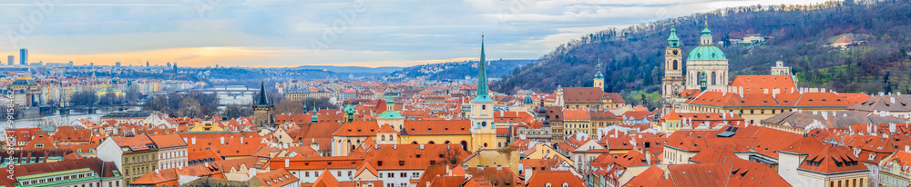 Panoramic view onto red roofs of Prague and river Vltava