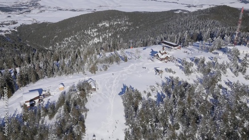 Aerial view of people skiing at the mountain.
