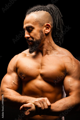 Muscular Young Man in Contrast Light