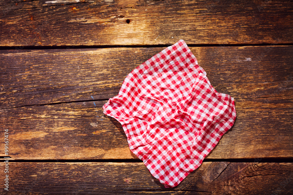 red tablecloth on wooden table red tablecloth on wooden table