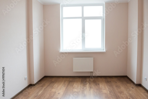 Empty room with window and wooden floor