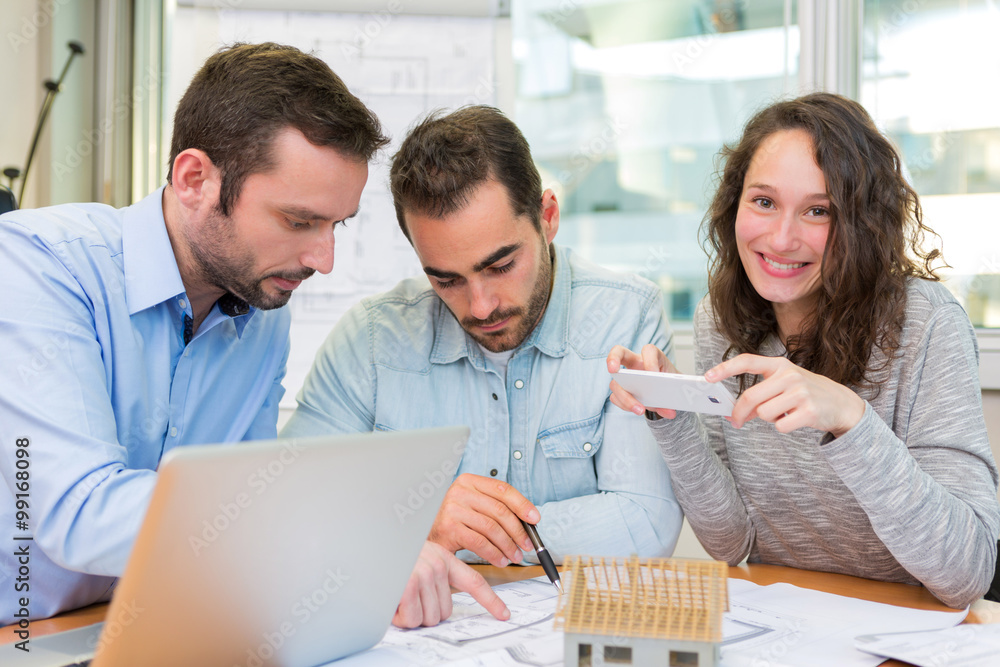 Fototapeta premium Young attractive people meeting real estate agent at the office