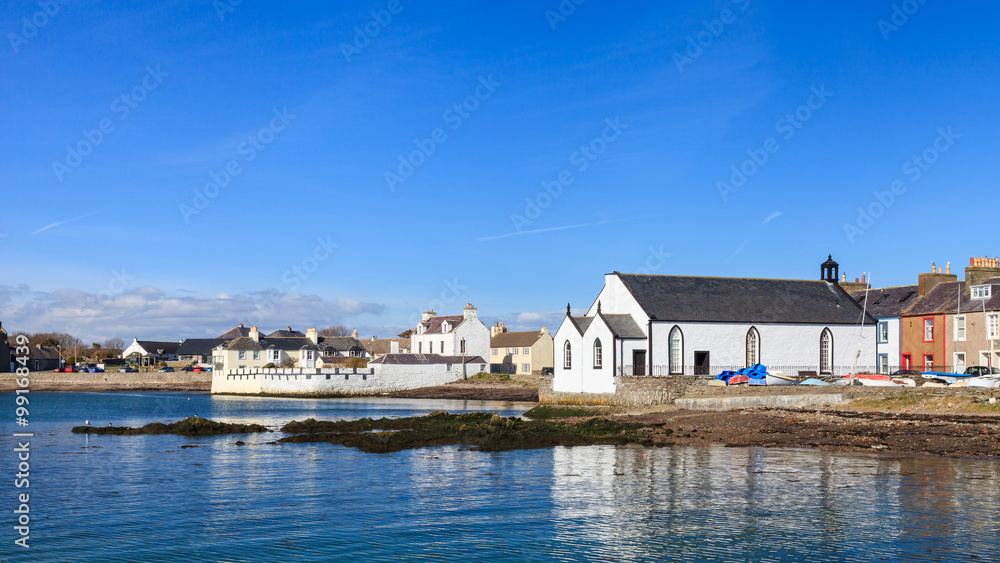 Fototapeta premium Isle of Whithorn Waterfront. The view across Isle of Whithorn Bay to the small coastal village of Isle of Whithorn in Dumfries and Galloway, Southern Scotland.
