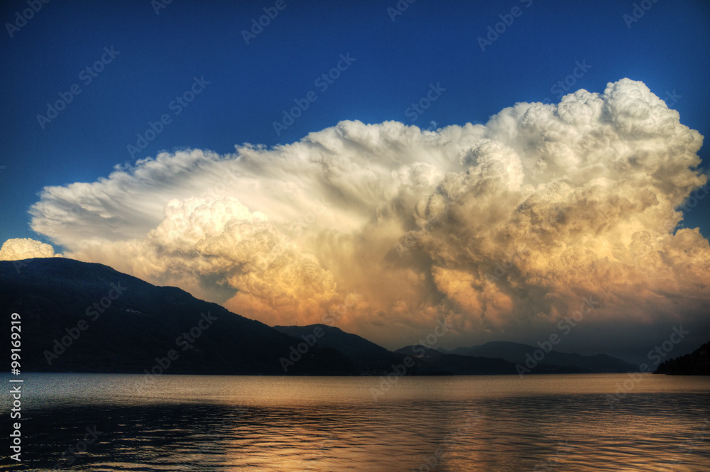 Approaching storm clouds at the lake. Photographed at the Lago Maggiore, Italy Approaching storm clouds at the lake. Photographed at the Lago Maggiore, Italy