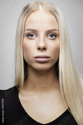 Portrait of a beautiful young woman with blonde hair