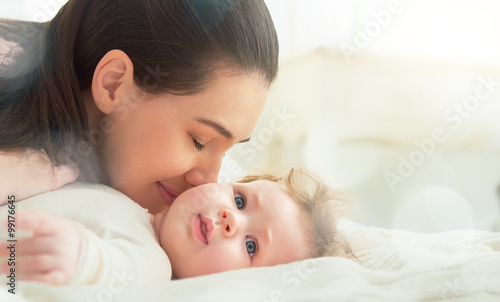 mother playing with her baby