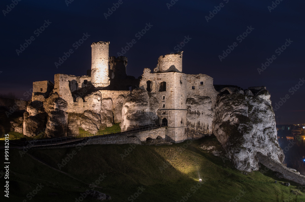 Ruins of medieval castle in Ogrodzieniec, Poland, illuminated in the night Ruins of medieval castle in Ogrodzieniec, Poland, illuminated in the night