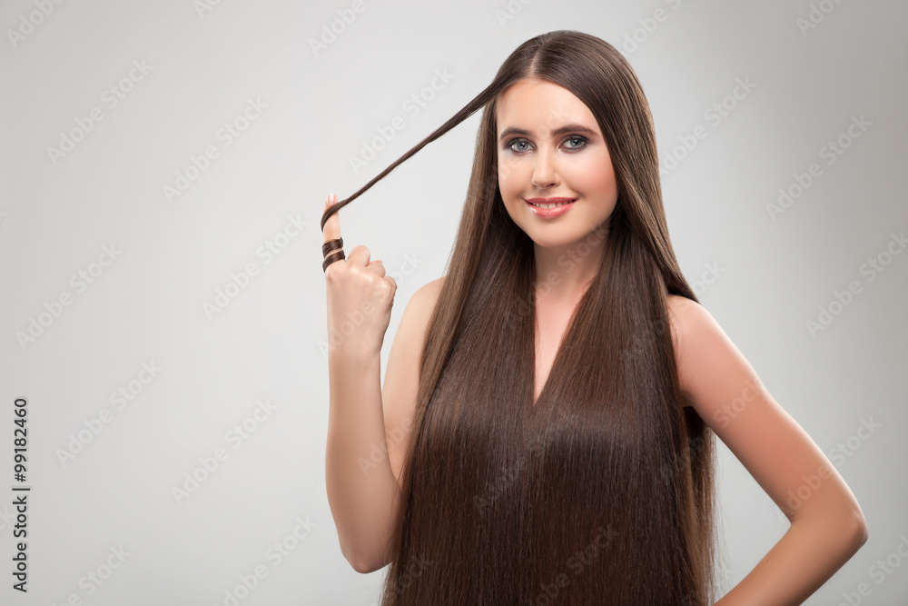 Obraz premium Pretty slim girl with healthy beautiful hairstyle