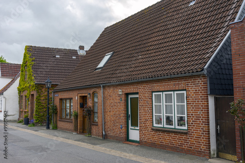 Fototapeta Naklejka Na Ścianę i Meble -  Street view od a town Toenning on the Eider river near its mouth at the North Sea in the district of Nordfriesland in the German state of Schleswig-Holstein.
