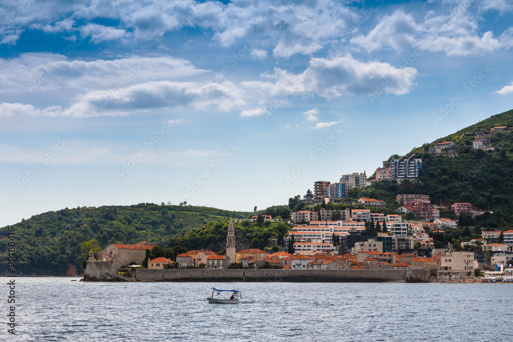 View of the old town of Budva, sea bay and mountains distance in summertime.