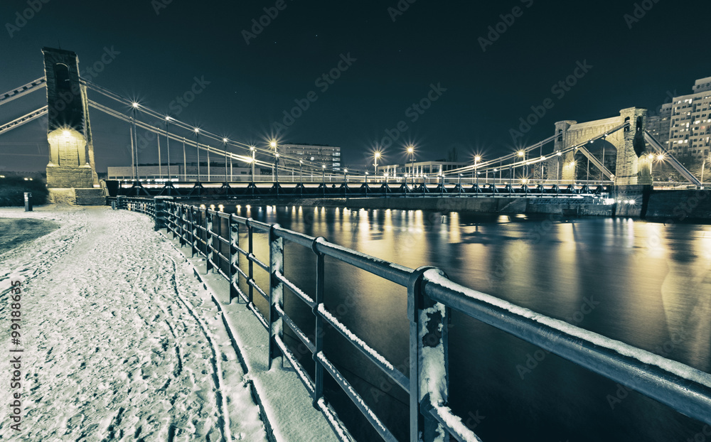 Obraz premium view on bridge at night in winter time in wroclaw, poland
