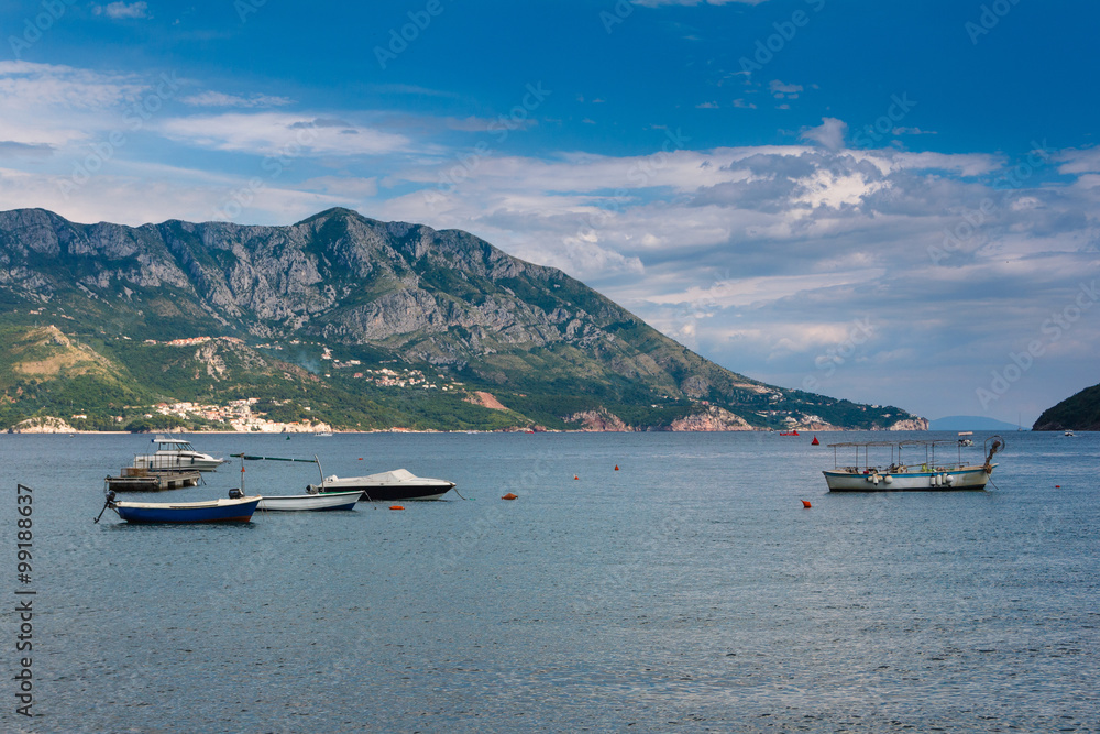 View of the old town of Budva, sea bay and mountains distance in summertime.