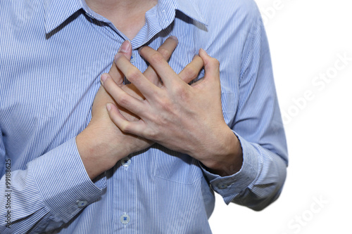 isolated man having a heart attack grab his chest with pain