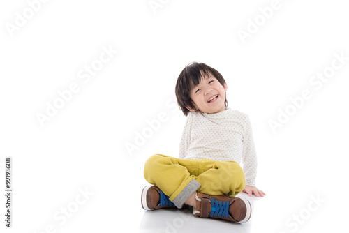 asian boy sitting on white background isolated photo