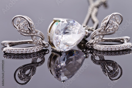 silver earrings in the shape of horseshoe and silver bracelet