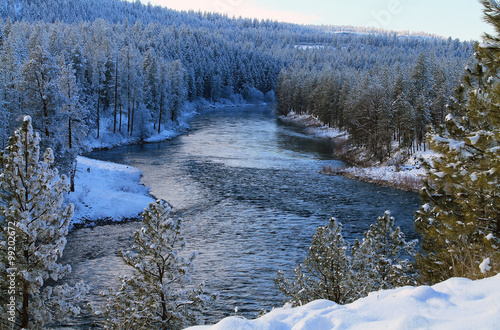 Spokane River Flowing Through a Snowy Forest