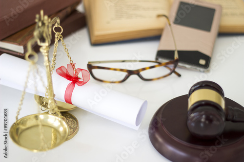 Law concept, gavel, scale, boks, mobile phone and diploma photo