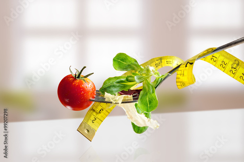 Concept diet fork with salad and metro horizontal composition Fototapeta