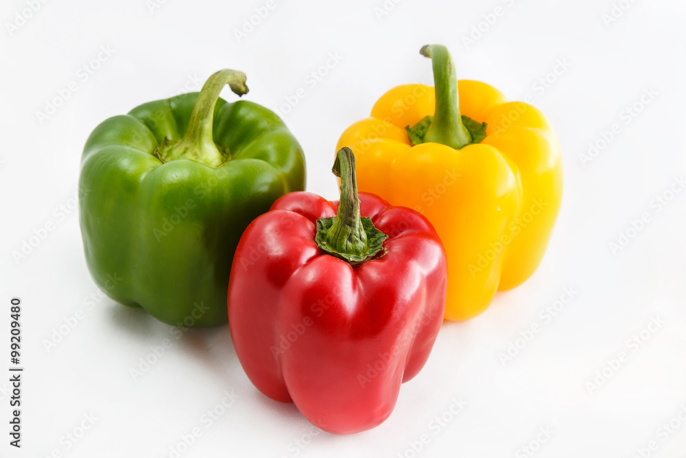 Fresh peppers. Three sweet Red, Yellow, Green Peppers isolated on white background. Fresh peppers. Three sweet Red, Yellow, Green Peppers isolated on white background.