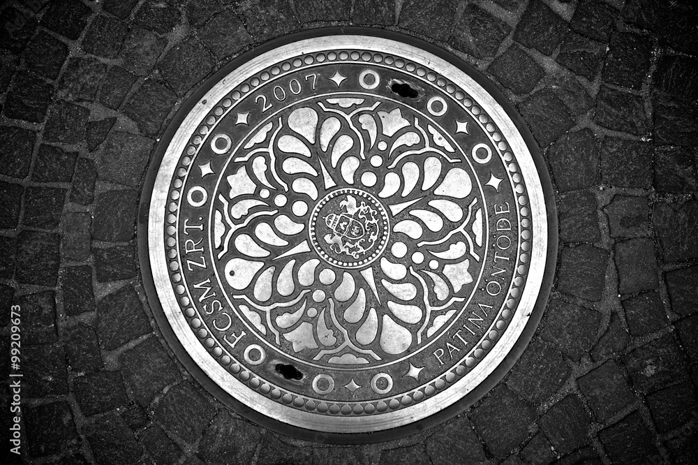 Decorative manhole cover from Budapest, Hungary.