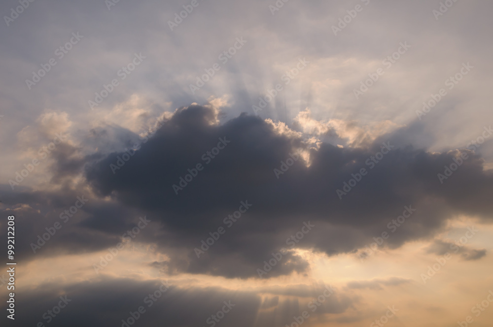 Rays of light shining through clouds, sunset Rays of light shining through clouds, sunset
