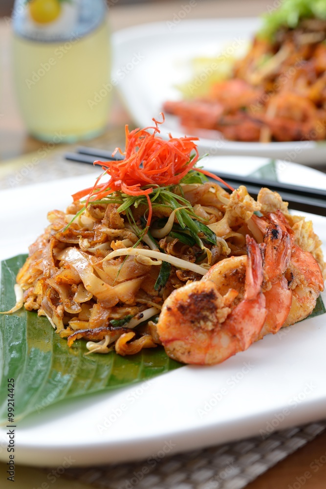 Stir fried penang char kway teow with orange juice Stir fried penang char kway teow with orange juice