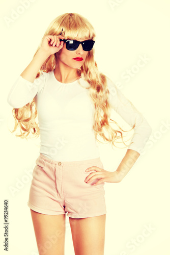 Sexy blonde woman in sunglasses.