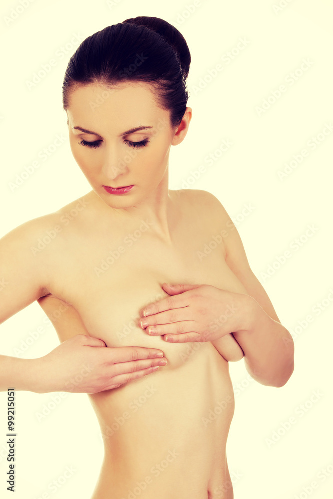 Obraz premium Woman examining breast.