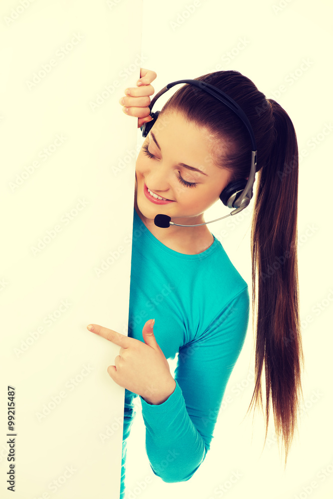 Call center woman pointing on billboard. Call center woman pointing on billboard.