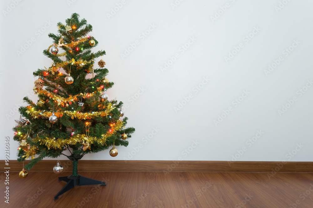 christmas tree decoration in empty room with white wall and wood christmas tree decoration in empty room with white wall and wood