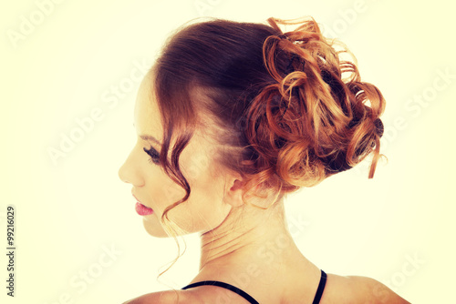 Elegant woman with curly hair.