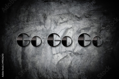 Foto Go Go Go Concept - Go Go Go sign on old cement black wall