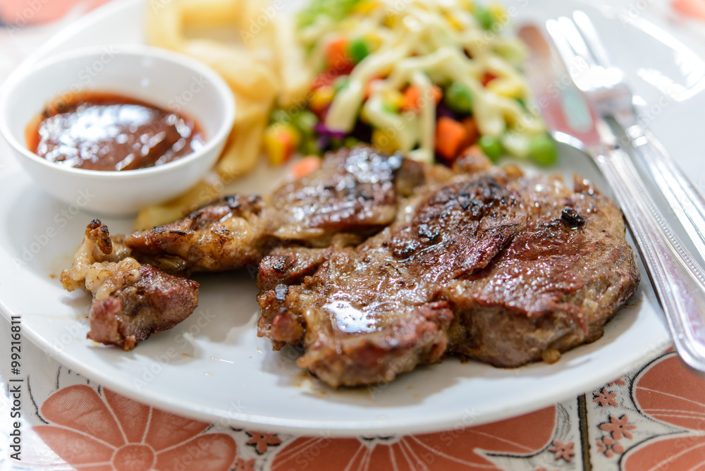 Beef steak on plate.Soft focus.