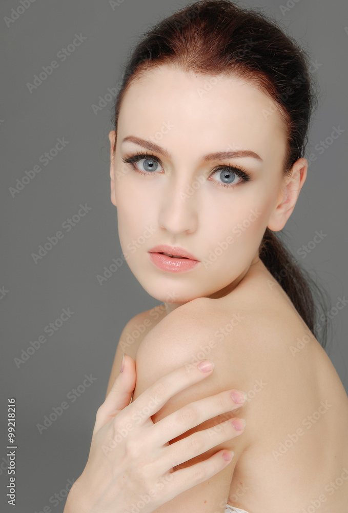 Beauty face of beautiful woman with clean fresh skin-gray background Beauty face of beautiful woman with clean fresh skin-gray background