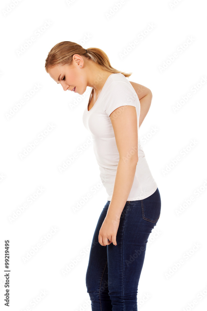 Young woman with back ache Young woman with back ache