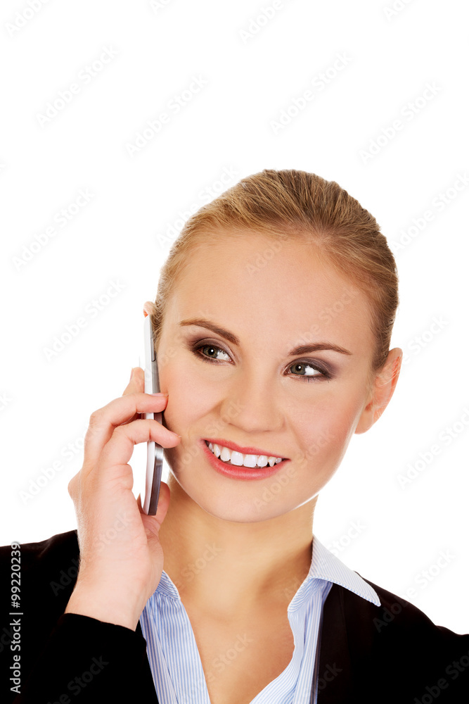 Smiling business woman talking through the phone. Smiling business woman talking through the phone.