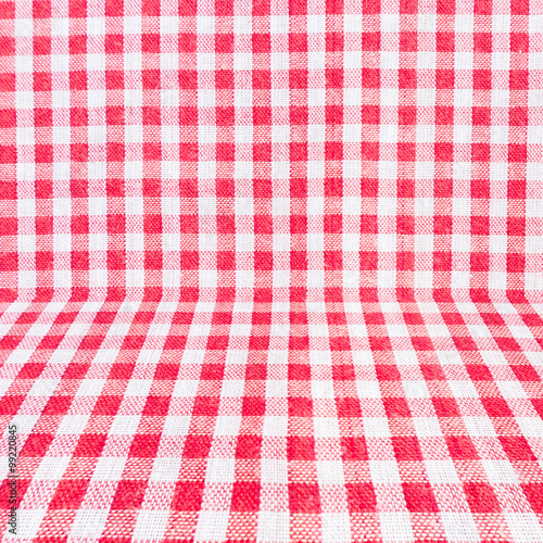 Red classic checkered tablecloth texture, background with copy s