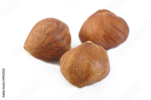 peeled hazelnuts isolated on white