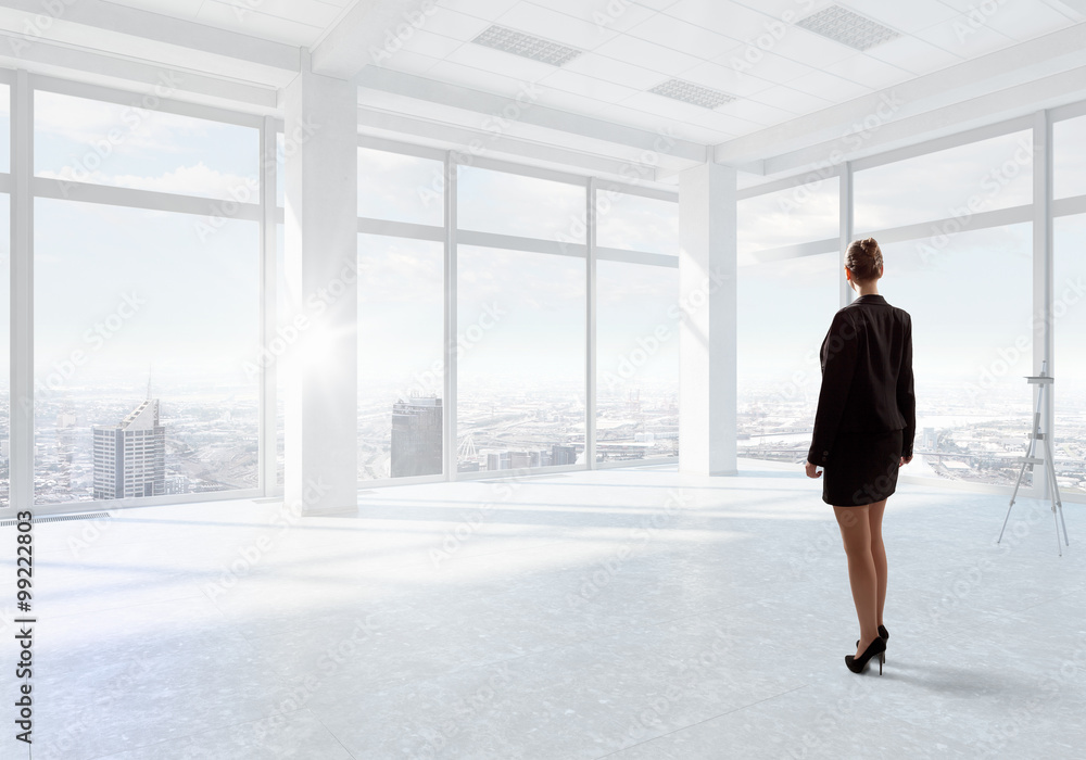 Businesswoman in top floor office
