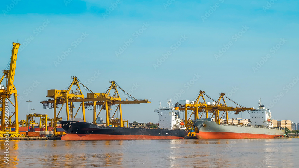 Large container ship unloaded by cranes at Port Large container ship unloaded by cranes at Port